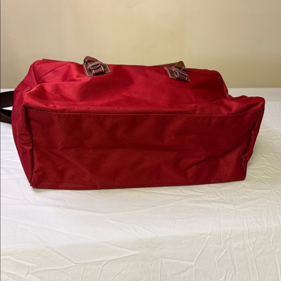 Red and Brown Travel Bag with Adjustable Strap and Sturdy Design - Picture 5 of 10